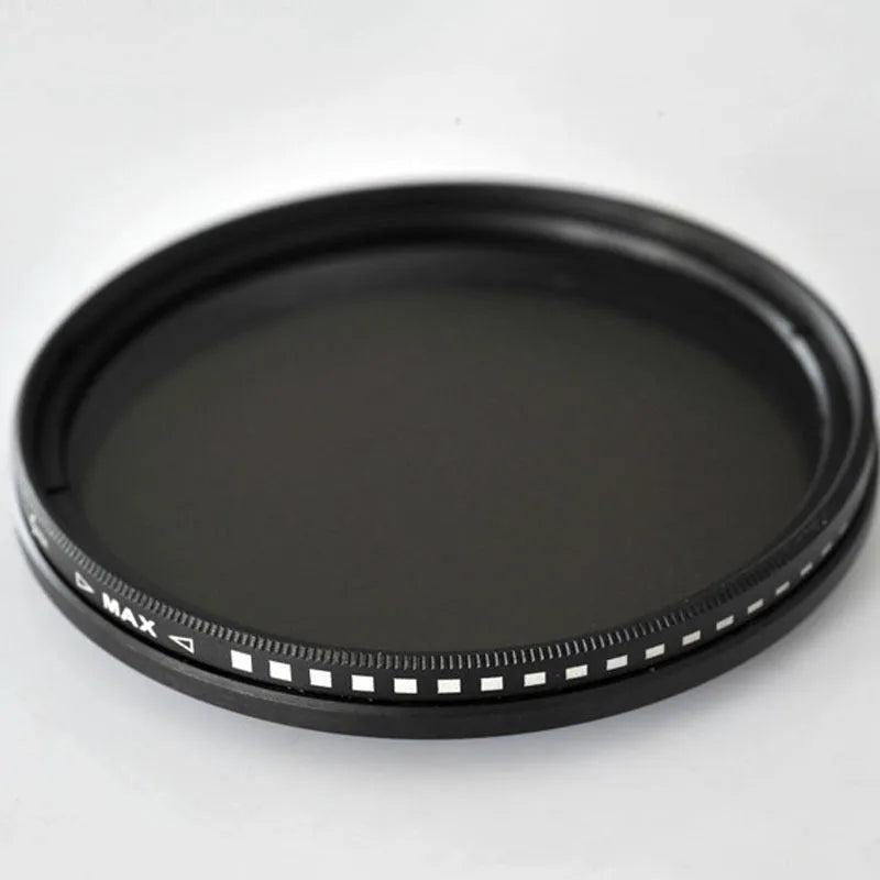 Adjustable camera ND filter kit with four density filters and a set of multi-diameter metal adapter rings.