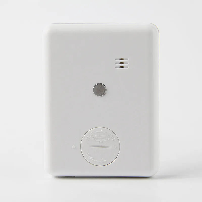 Digital kitchen timer with magnetic back showing LCD countdown display on refrigerator