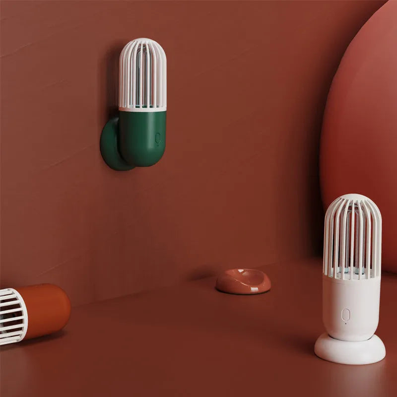 Portable capsule ultraviolet disinfection lamp in black, brown, green or white with display showing 52x52x136mm dimensions