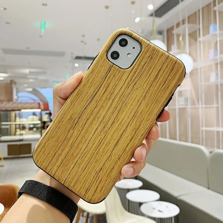 Wooden iPhone back cover case in rosewood finish showing precise cutouts for camera and ports.