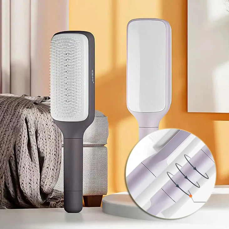 Roland purple and lunar rock grey self-cleaning hair brush with anti-static massage comb teeth.