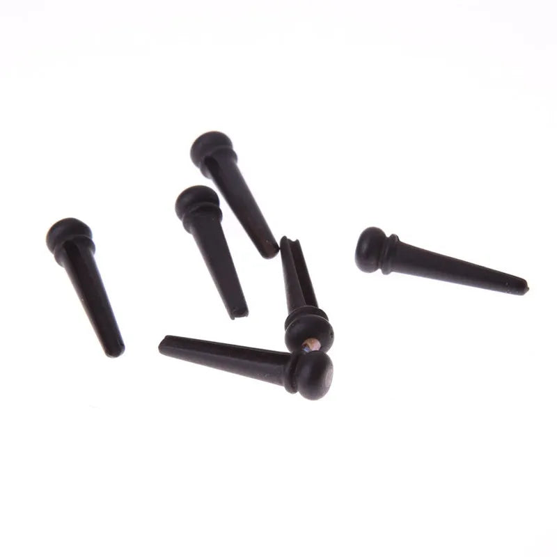 Six ebony guitar string nails with matt black finish for folk acoustic guitar bridge installation