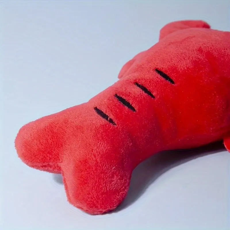 Red lobster-shaped squeaky dog toy for small and medium breeds on white background