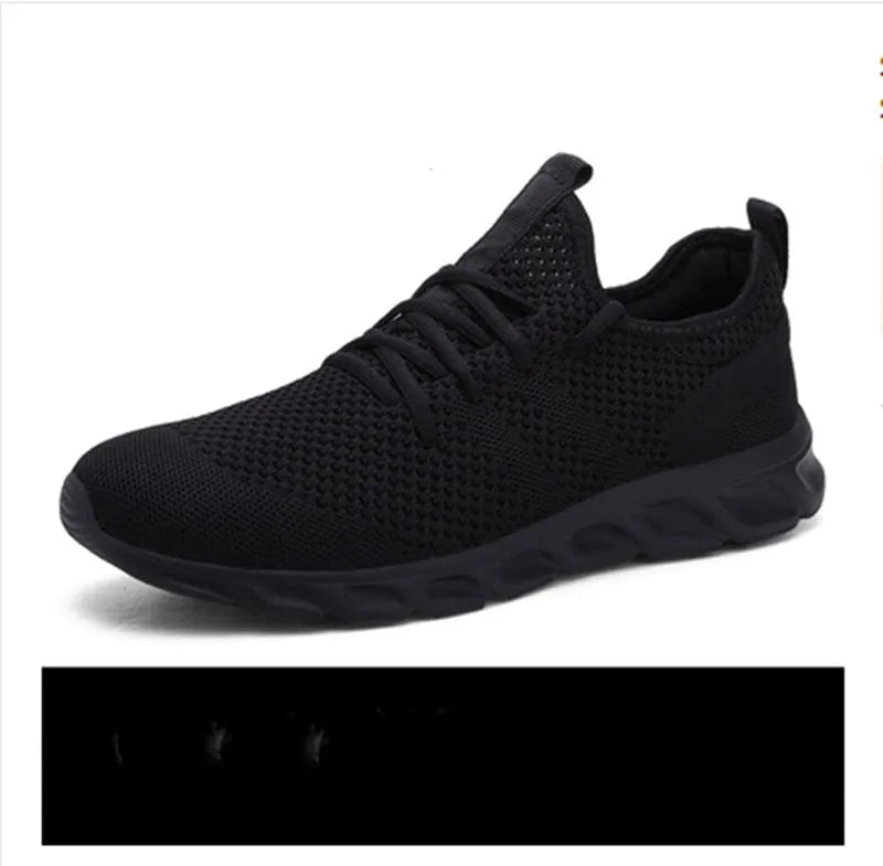 Men's black and white mesh sneakers with round toe and lace-up fastening
