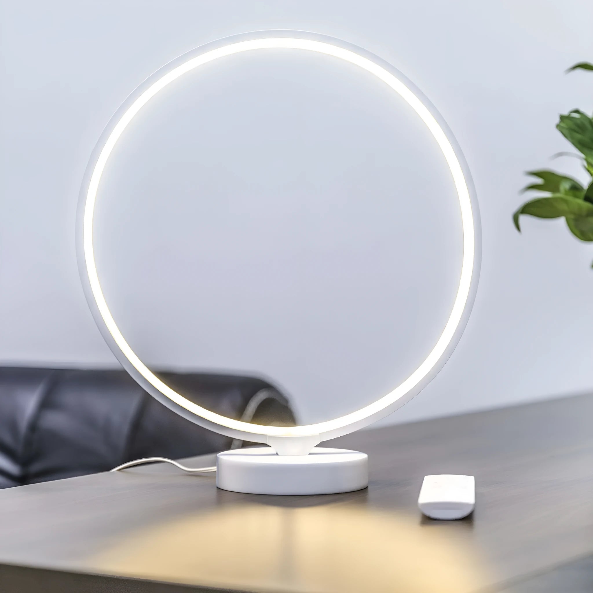 Full Moon Lamp table lamp with circular design showing adjustable white and coloured lighting options