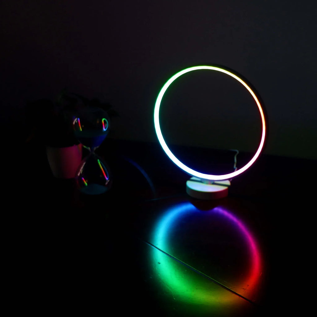 Full Moon Lamp table lamp with circular design showing adjustable white and coloured lighting options