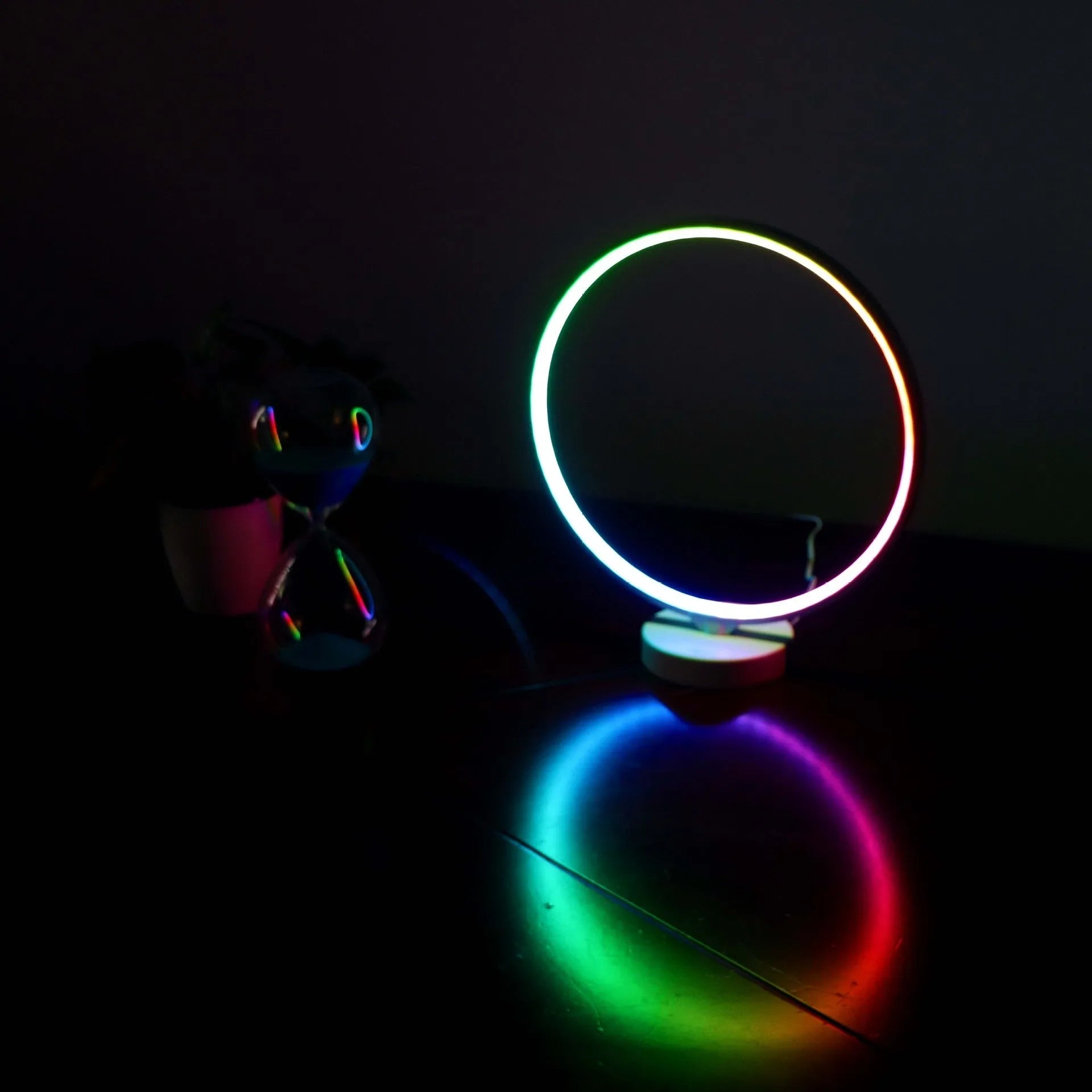 Full Moon Lamp table lamp with circular design showing adjustable white and coloured lighting options