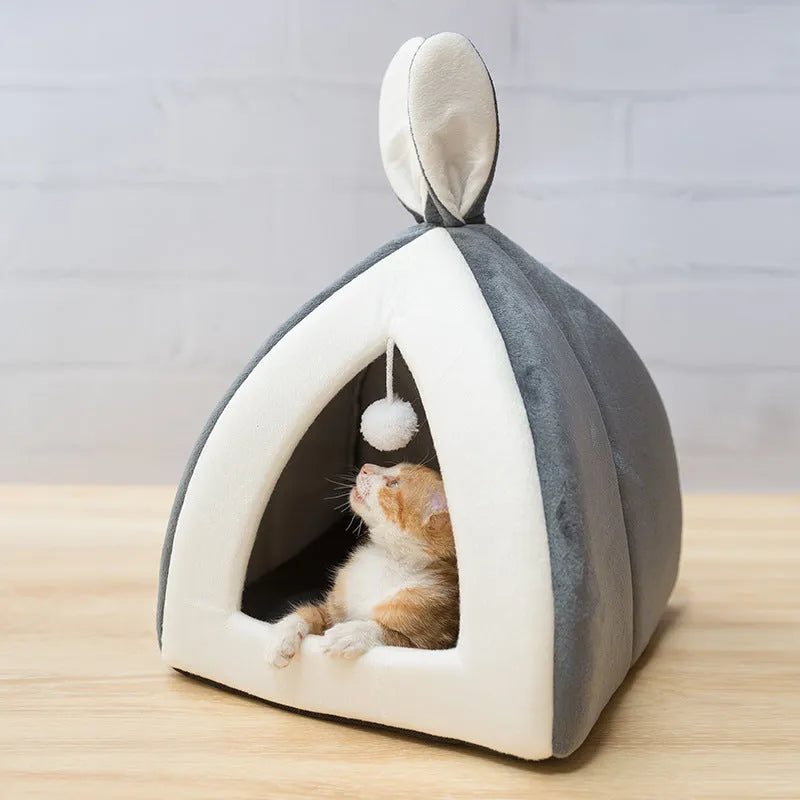 Grey fabric cat house with plush interior shown in medium size
