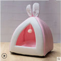 Grey fabric cat house with plush interior shown in medium size