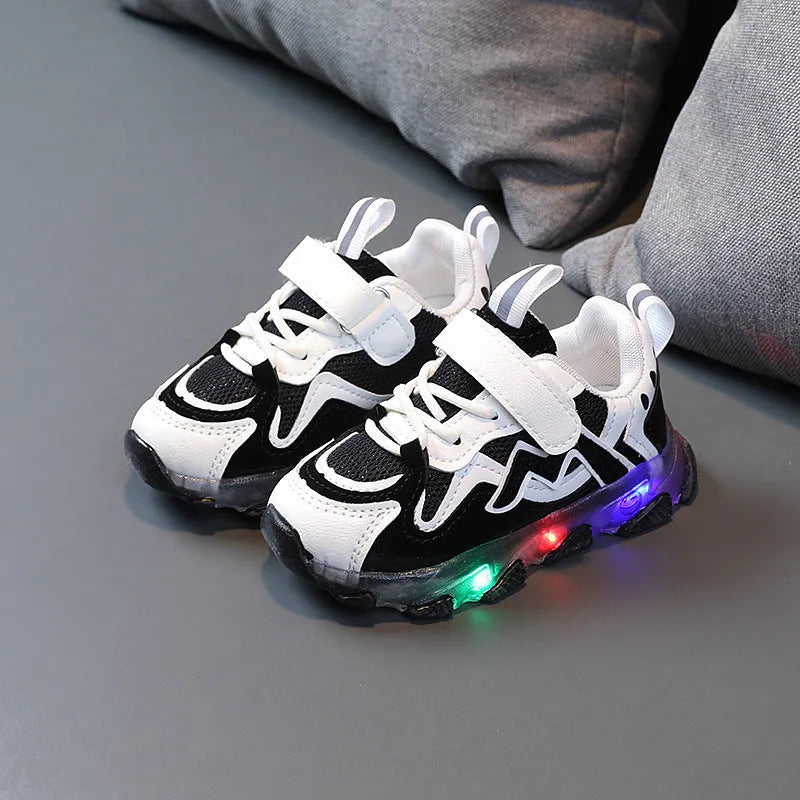 Children's mesh velcro trainers in black, pink, or grey with a rubber sole