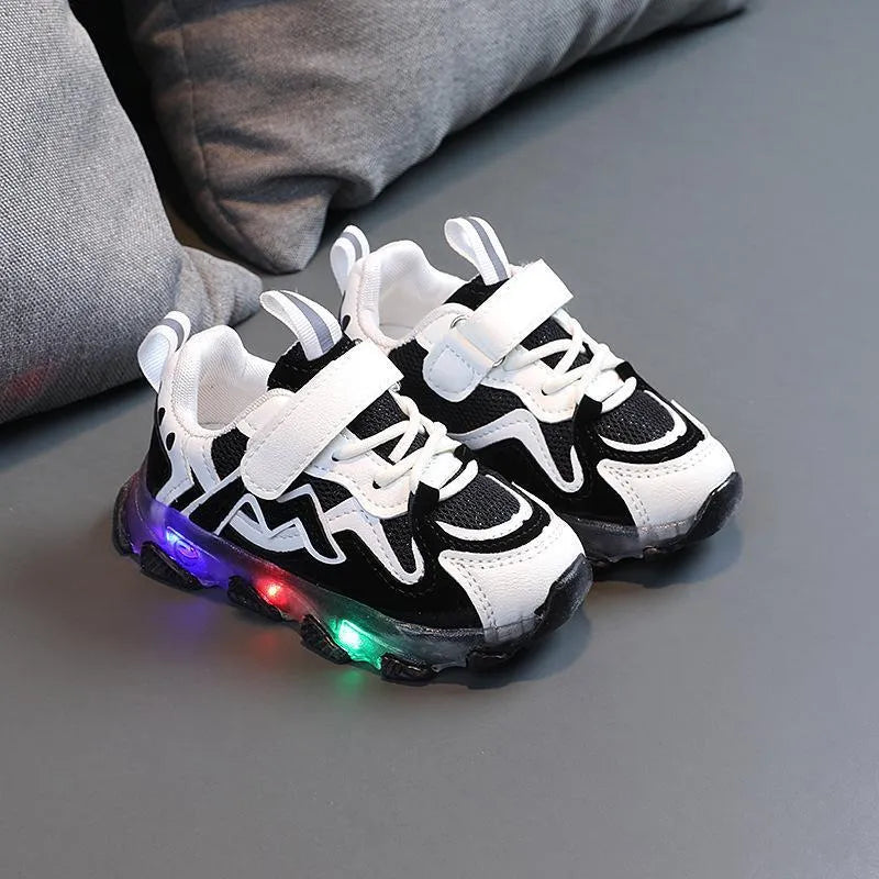 Children's mesh velcro trainers in black, pink, or grey with a rubber sole