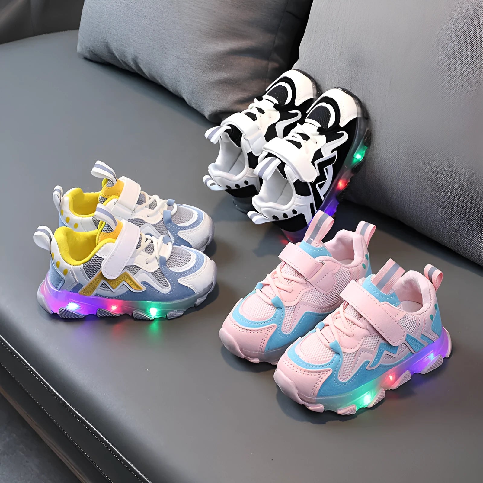 Children's mesh velcro trainers in black, pink, or grey with a rubber sole