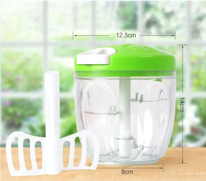 Manual kitchen chopper with green ABS container and stainless steel blades for herb and vegetable preparation