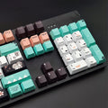 Green Cherry profile mechanical keyboard keycaps with animation detailing on white background