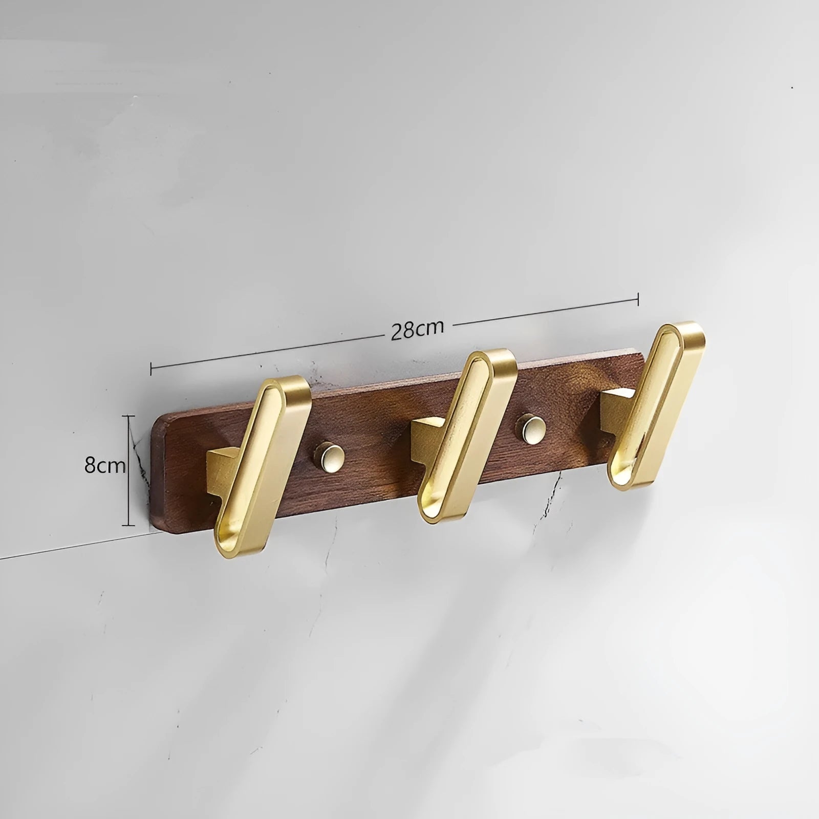 Black walnut bathroom clothes hook row with brass-finished aluminium hooks in perforated mounting design