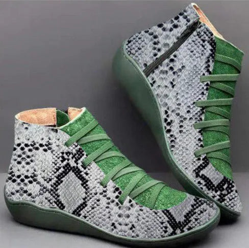 Women's black casual ankle booties with a flat wedge heel and round toe, made from PU with a rubber sole.