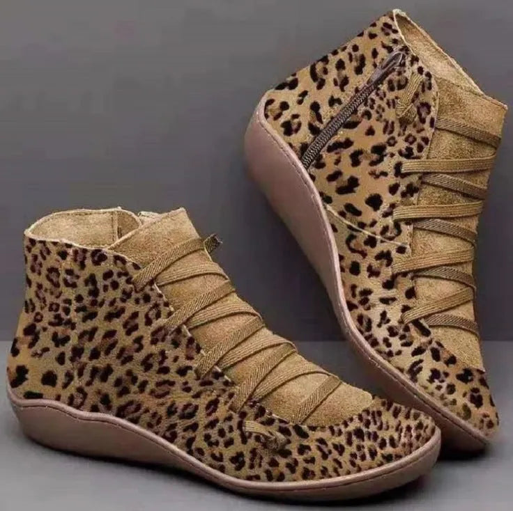 Women's black casual ankle booties with a flat wedge heel and round toe, made from PU with a rubber sole.