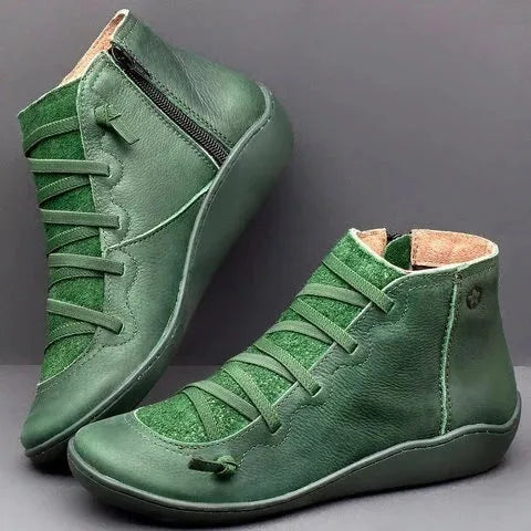 Women's black casual ankle booties with a flat wedge heel and round toe, made from PU with a rubber sole.