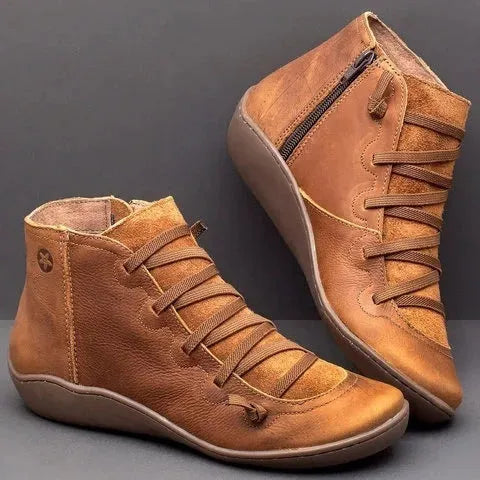 Women's black casual ankle booties with a flat wedge heel and round toe, made from PU with a rubber sole.
