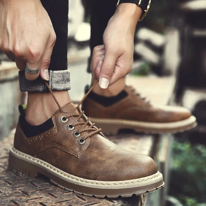 Men's brown casual shoes with round toe and front lace closure showing rubber sole detail
