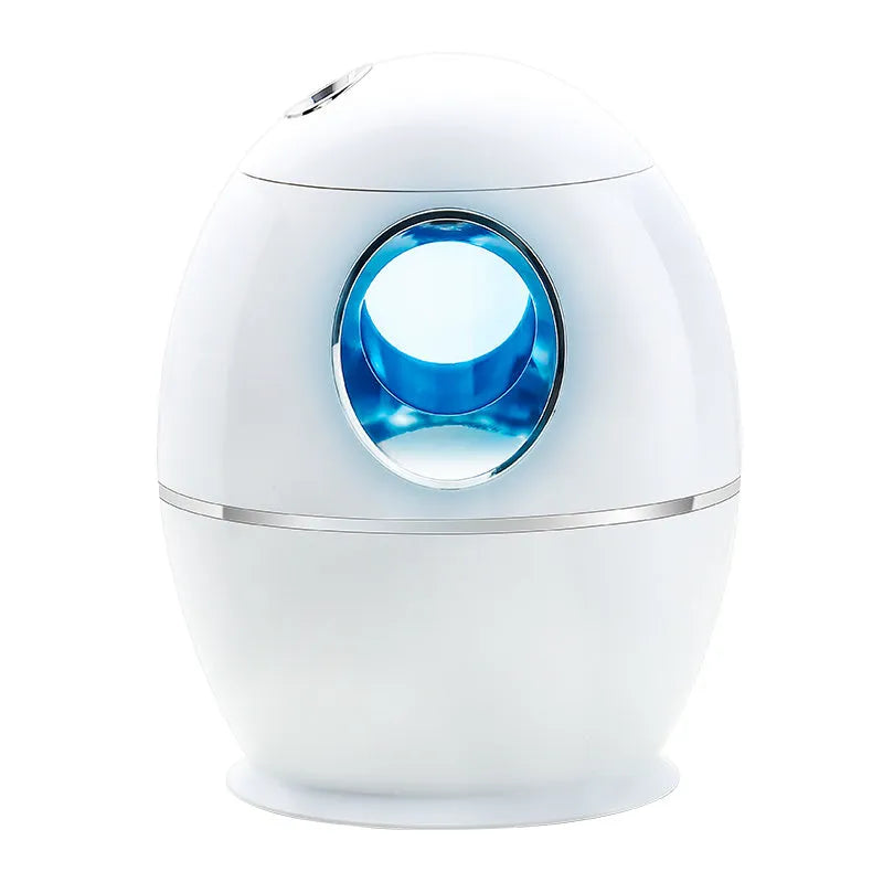 White round USB-powered aromatherapy spray humidifier on a table.