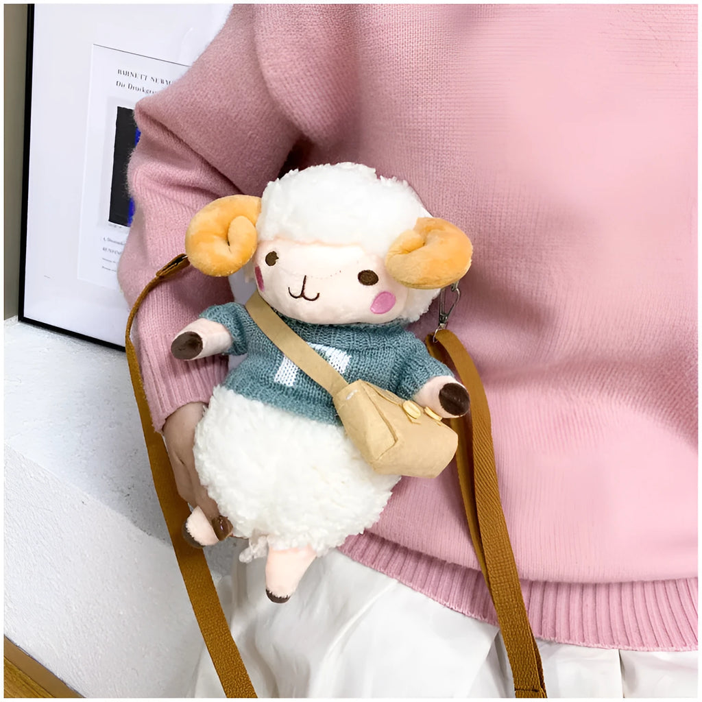 Small blue plush crossbody bag with a lamb pattern and zip pocket.