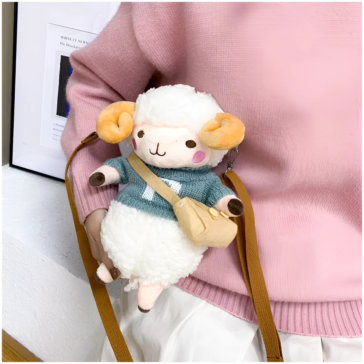 Small blue plush crossbody bag with a lamb pattern and zip pocket.