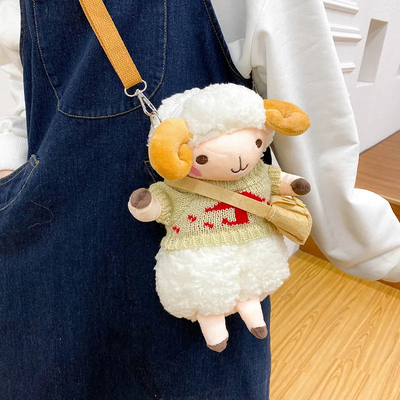 Small blue plush crossbody bag with a lamb pattern and zip pocket.