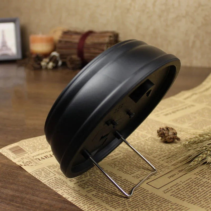 European retro style round desk clock with silent alarm function on wooden surface