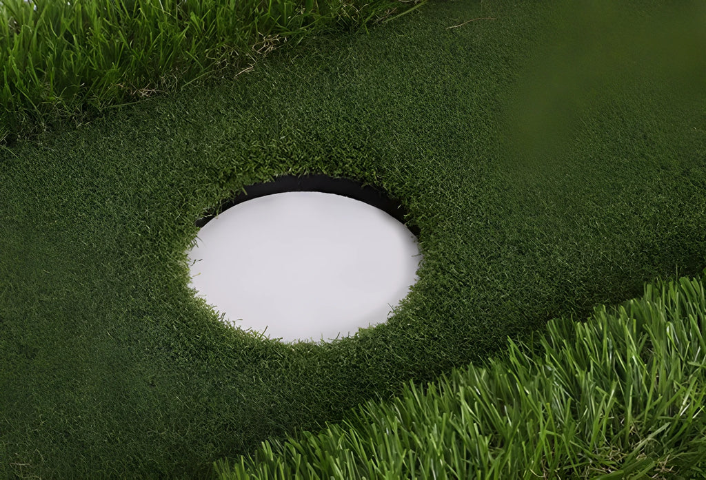 Green rectangular golf training mat on a flat surface, showing PP grass texture and EVA foam base.