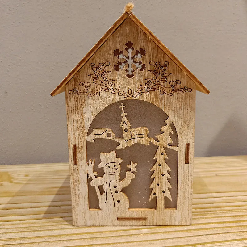 Natural wood Christmas decorations: small log bell and wooden houses with old man and snowman figures