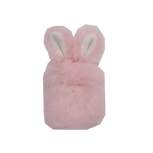 Plush pink silicone AirPods protective cover with cute raised rabbit ears on a white charging case.