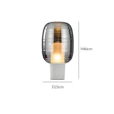 8029 glass table lamp in cognac colour with simple modern design and push button switch.