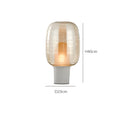 8029 glass table lamp in cognac colour with simple modern design and push button switch.
