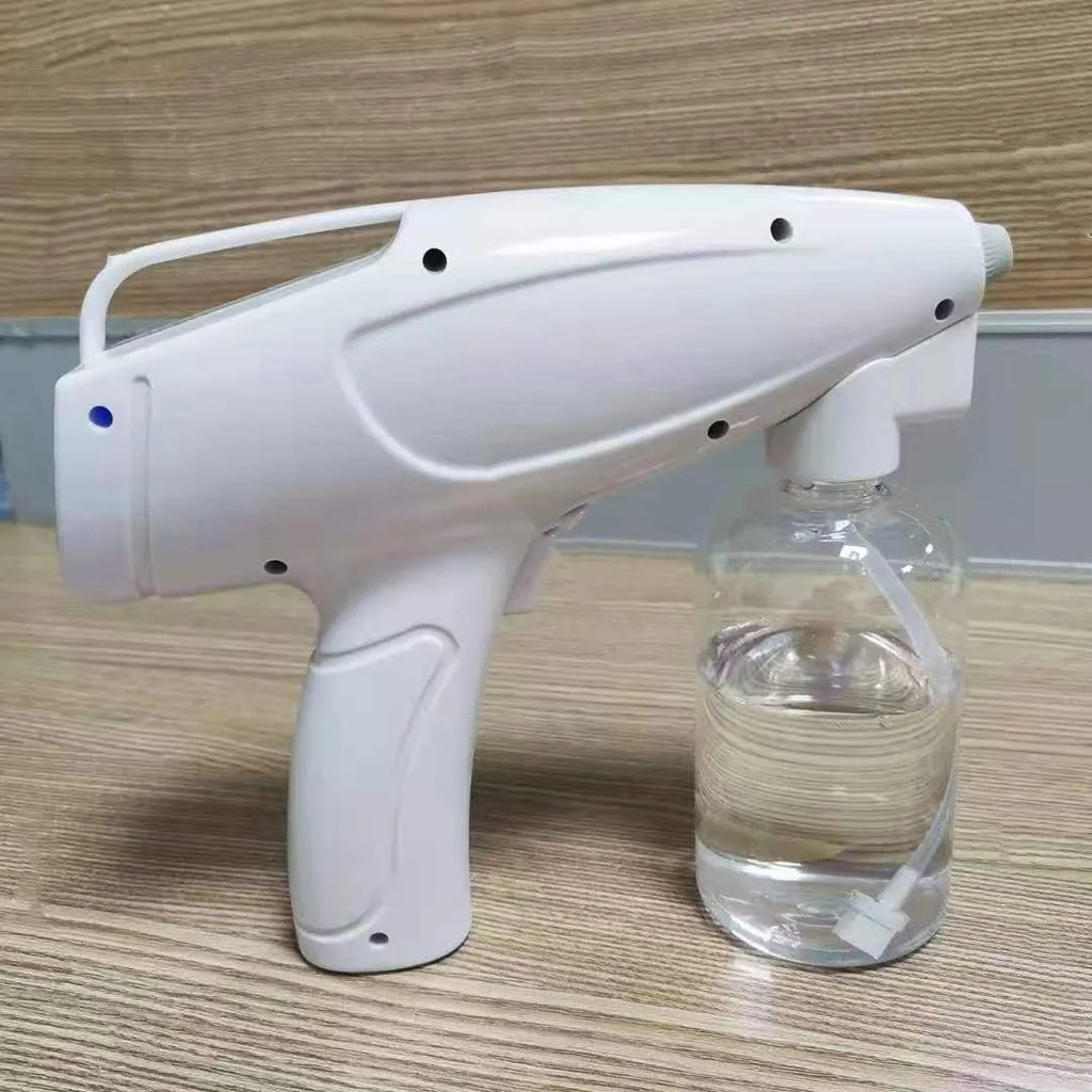 White handheld cordless electric spray gun with USB charging cable on a white background.