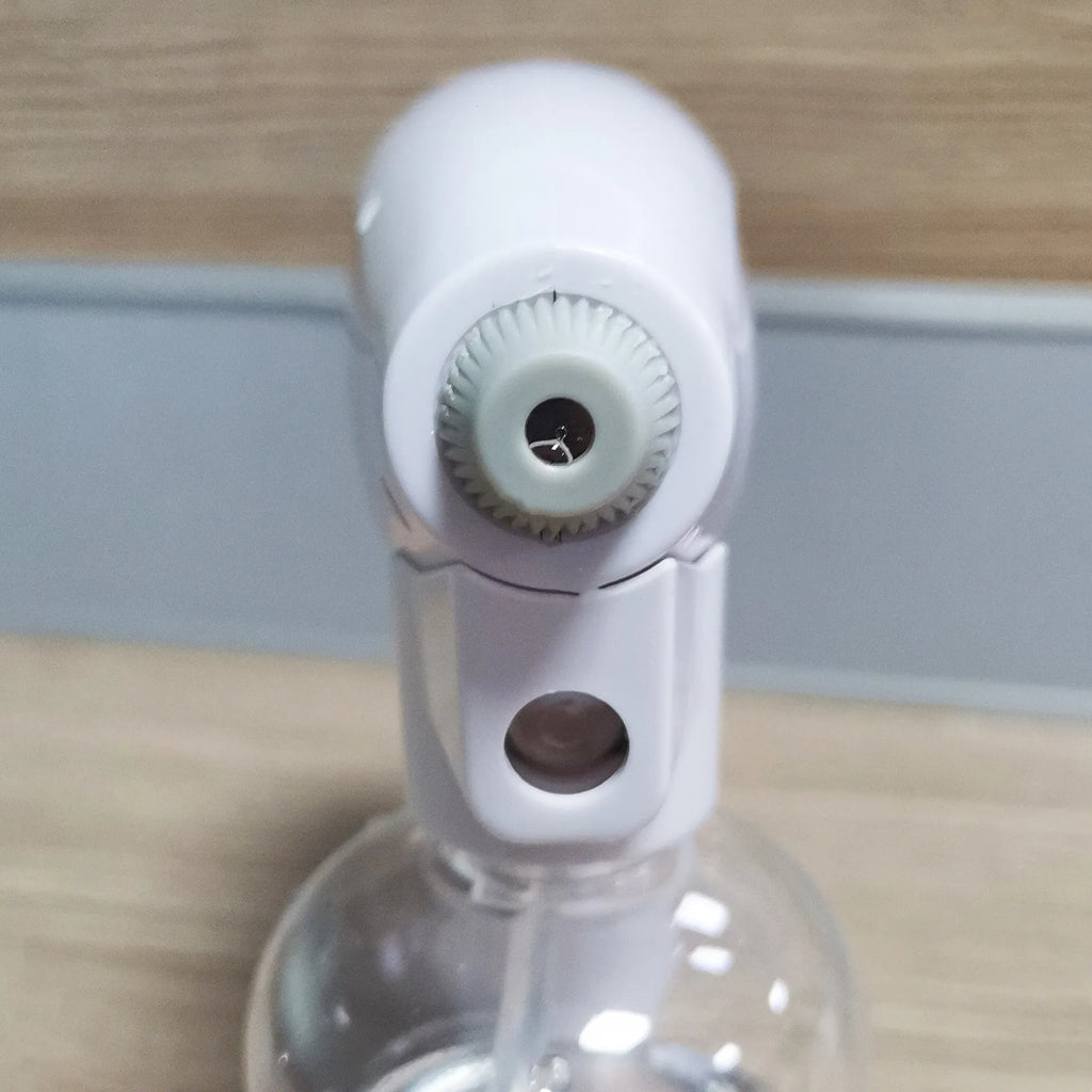 White handheld cordless electric spray gun with USB charging cable on a white background.