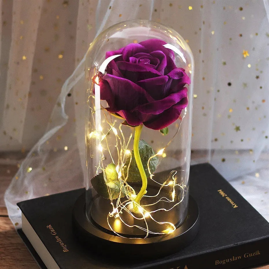 Silk rose bouquet with LED lights and glass shade in scarlet colour on wooden base