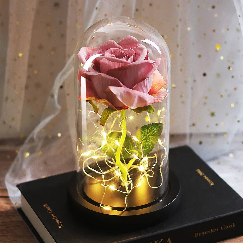 Silk rose bouquet with LED lights and glass shade in scarlet colour on wooden base