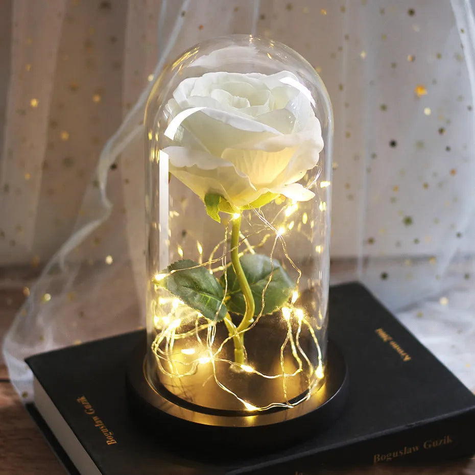 Silk rose bouquet with LED lights and glass shade in scarlet colour on wooden base