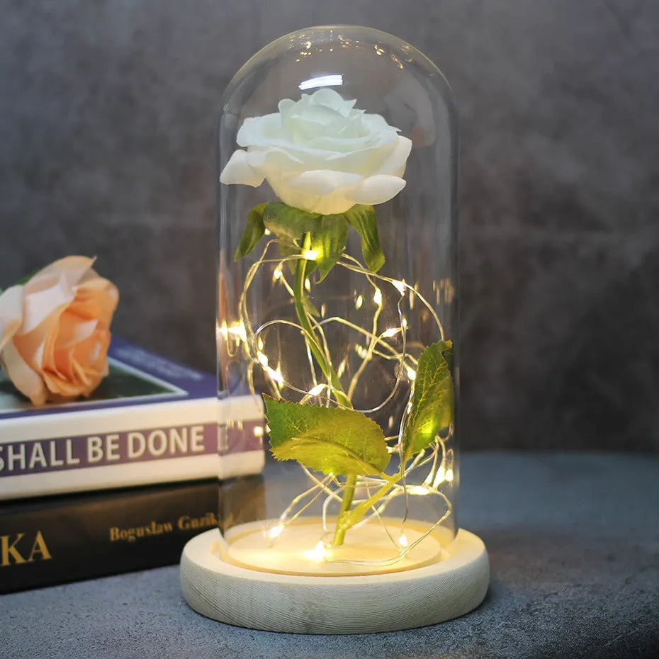 Silk rose bouquet with LED lights and glass shade in scarlet colour on wooden base