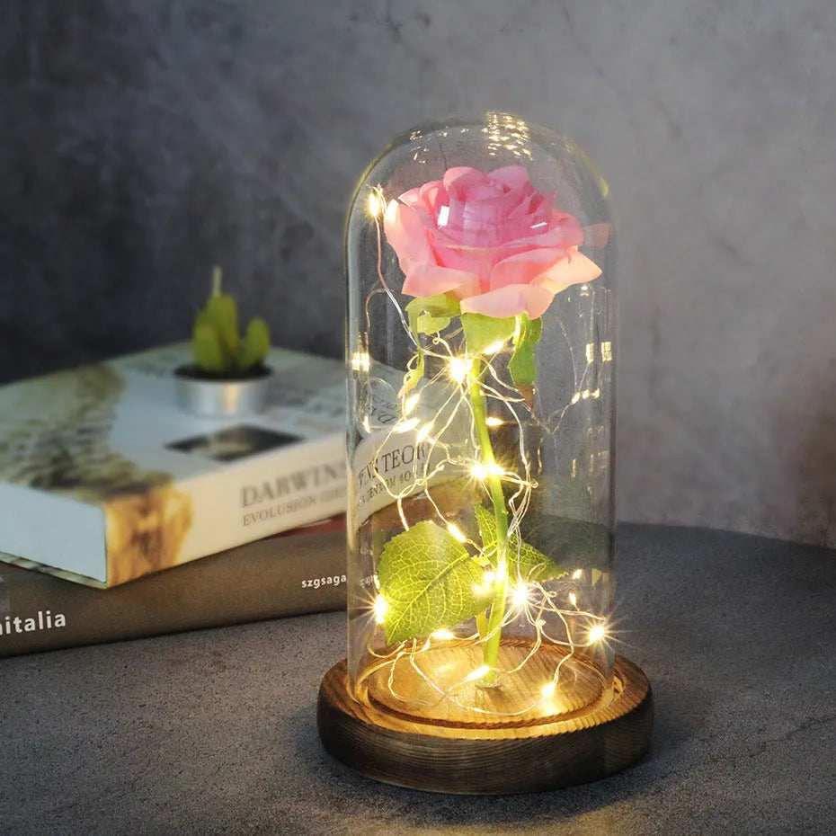 Silk rose bouquet with LED lights and glass shade in scarlet colour on wooden base