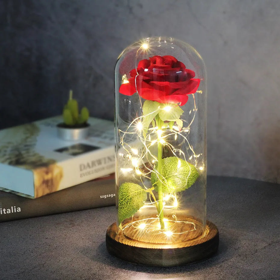 Silk rose bouquet with LED lights and glass shade in scarlet colour on wooden base