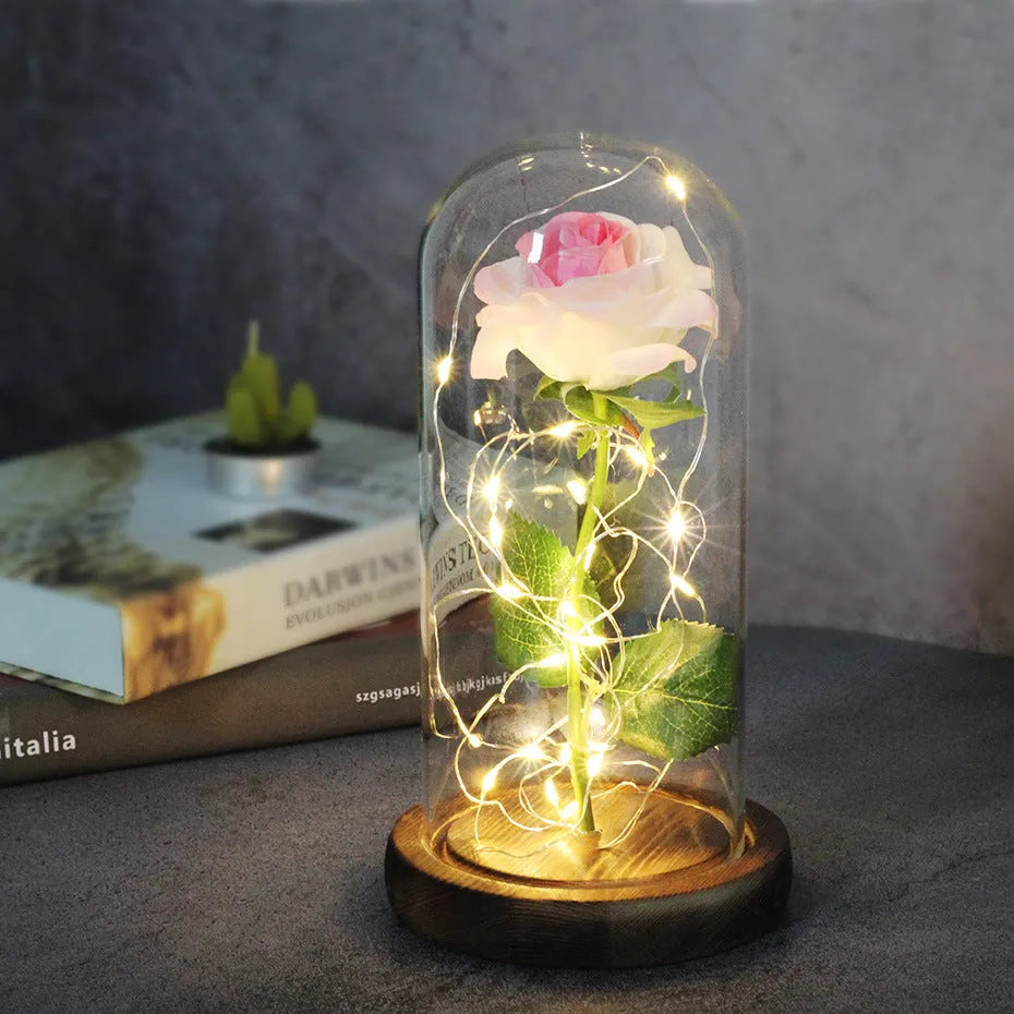 Silk rose bouquet with LED lights and glass shade in scarlet colour on wooden base