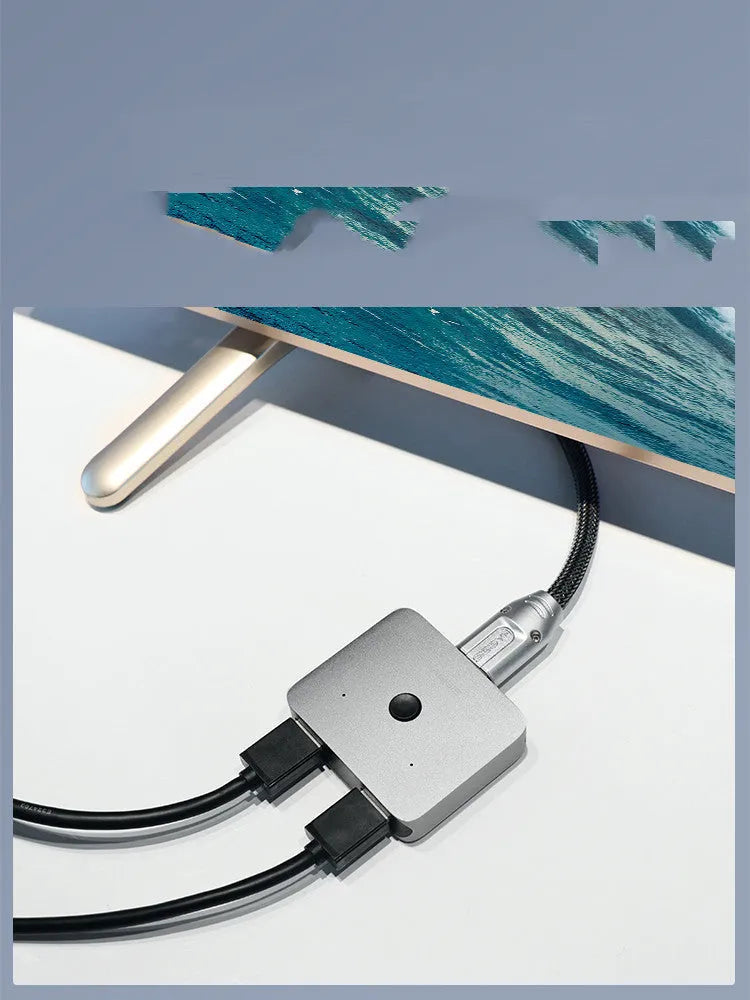 Grey HDMI splitter switcher with 2 input ports and 1 output port for connecting one video source to two displays