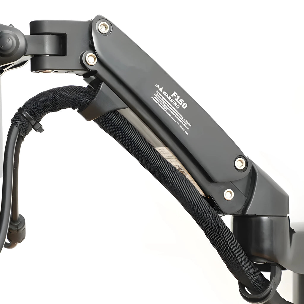 Black aluminium wall-mounted monitor stand extended from the wall with screen attached