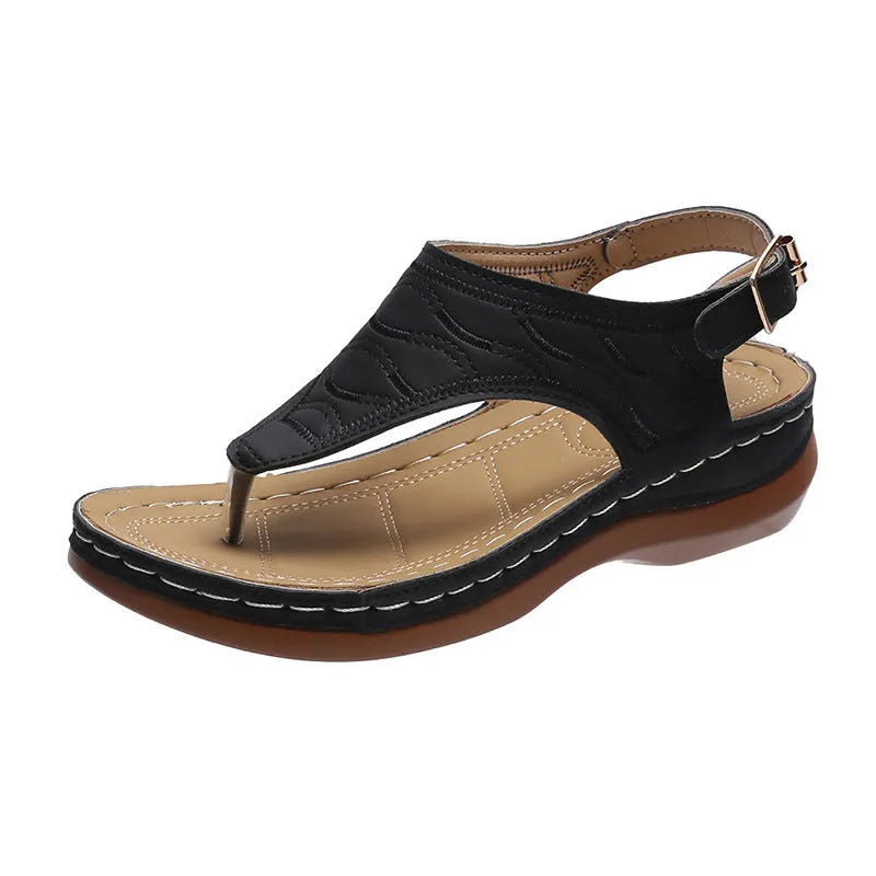 Women's casual wedge heel flip flop sandals with an adjustable buckle strap in black.
