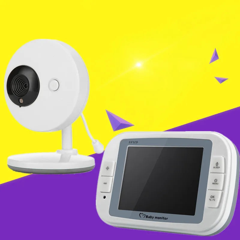 White wireless baby monitor with 3.5 inch screen and UFO-shaped camera unit on a table.