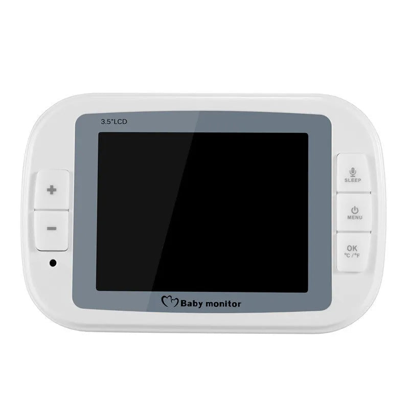 White wireless baby monitor with 3.5 inch screen and UFO-shaped camera unit on a table.