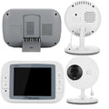 White wireless baby monitor with 3.5 inch screen and UFO-shaped camera unit on a table.