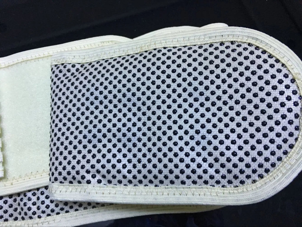 Black self-heating magnetic waist support belt for lumbar muscle strain, shown on a mannequin.